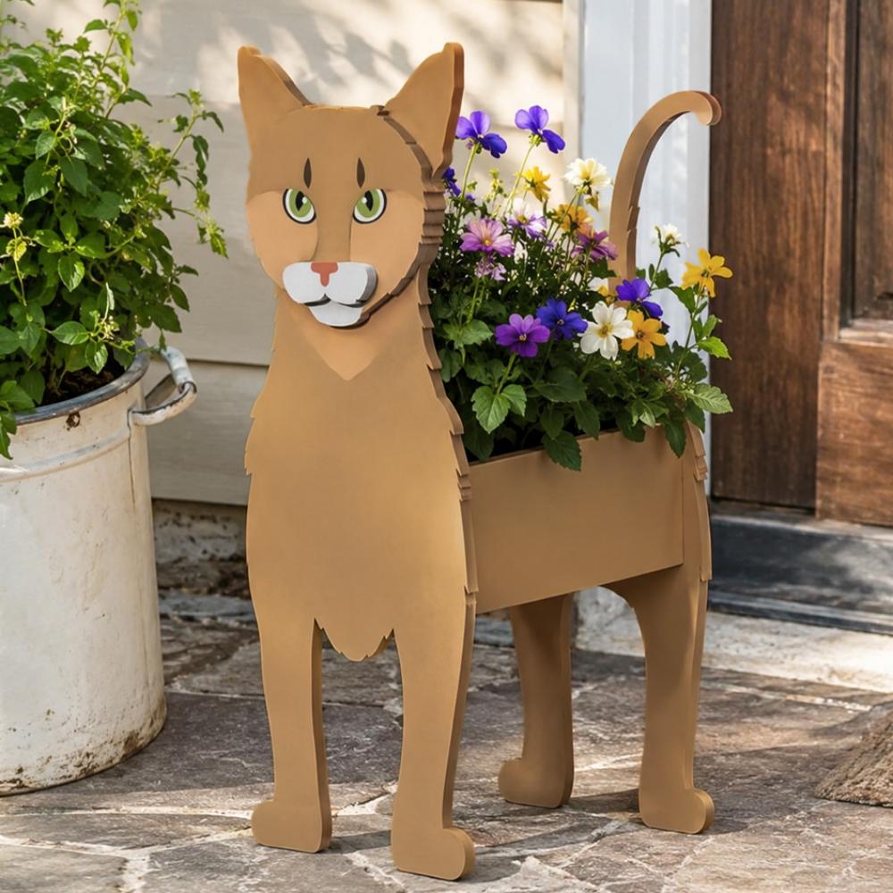 Abyssinian cat planter filled with fresh flowers is placed in the garden