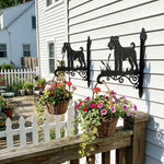 Airedale terrier metal hanging basket bracket mounted on outdoor wall for plant decoration