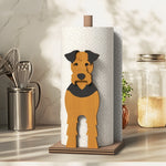 Airedale Terrier Wooden Dog Paper Towel Holder displayed on a kitchen countertop with a freestanding paper towel roll