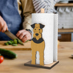 Airedale Terrier Wooden Dog Paper Towel Holder displayed on a kitchen countertop with a freestanding paper towel roll