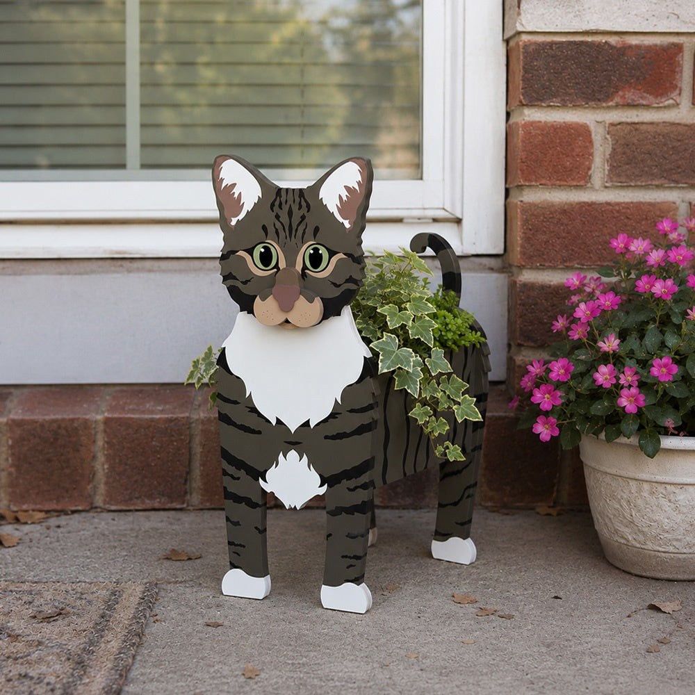 American Shorthair cat planter filled with fresh flowers is placed in the garden