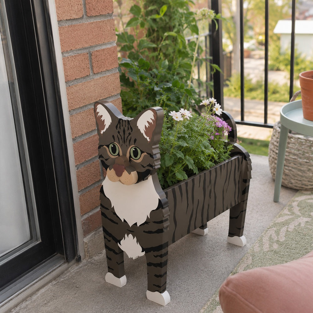 American Shorthair cat planter filled with fresh flowers is placed in the garden