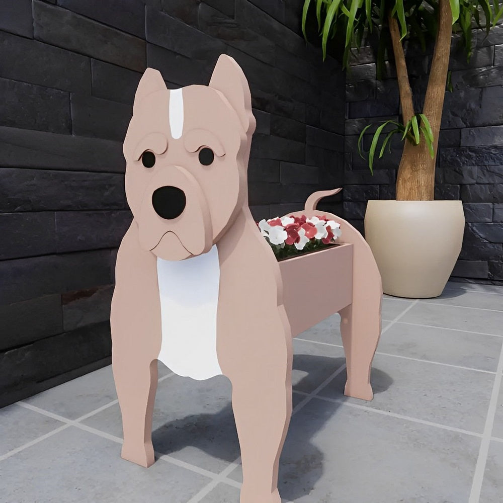 American Staffordshire Terrier dog planter filled with fresh flowers is placed in the garden