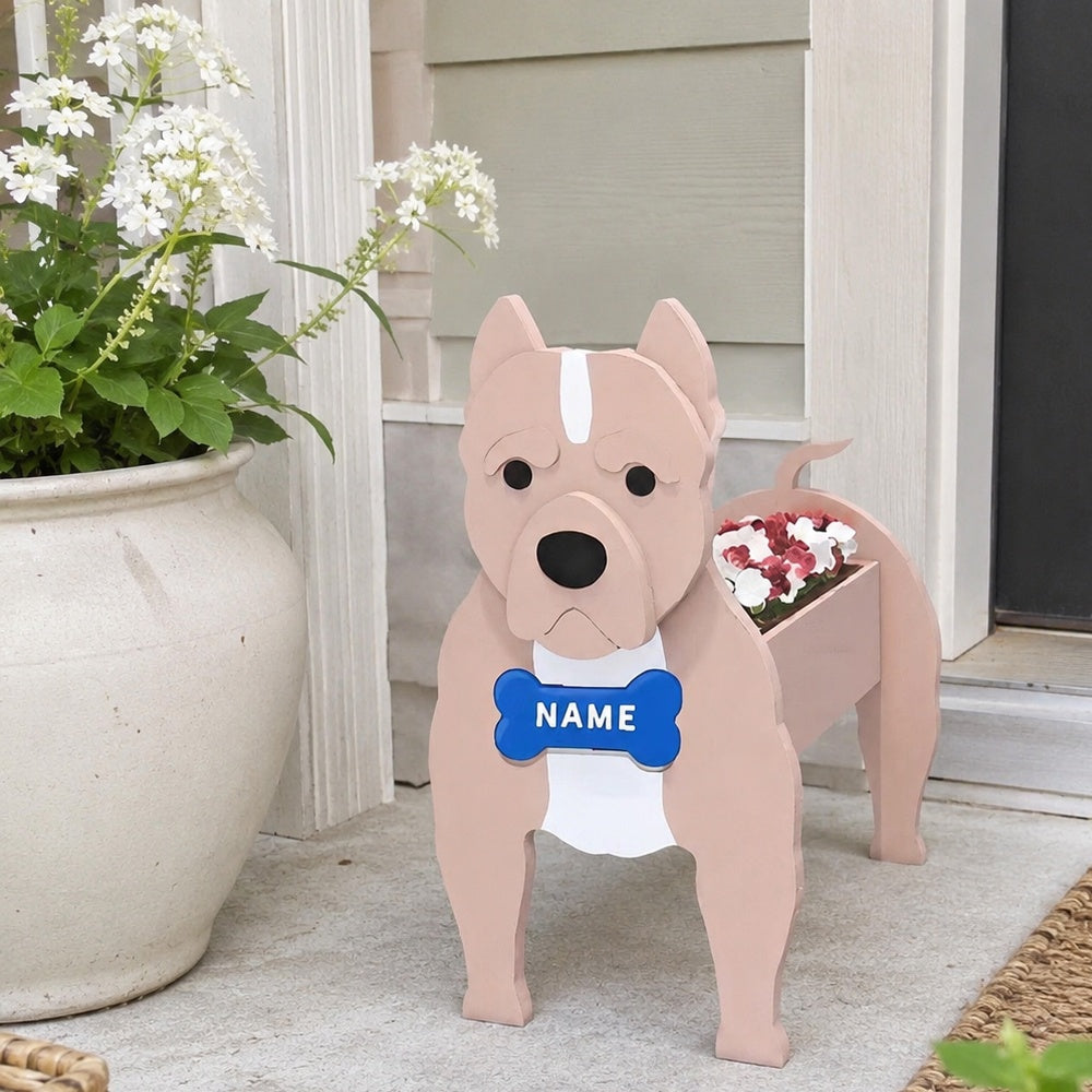 American Staffordshire Terrier dog planter filled with fresh flowers is placed in the garden