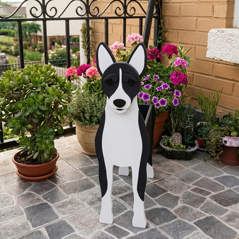 Black and white basenji-shaped dog planter decorated patio with potted plants
