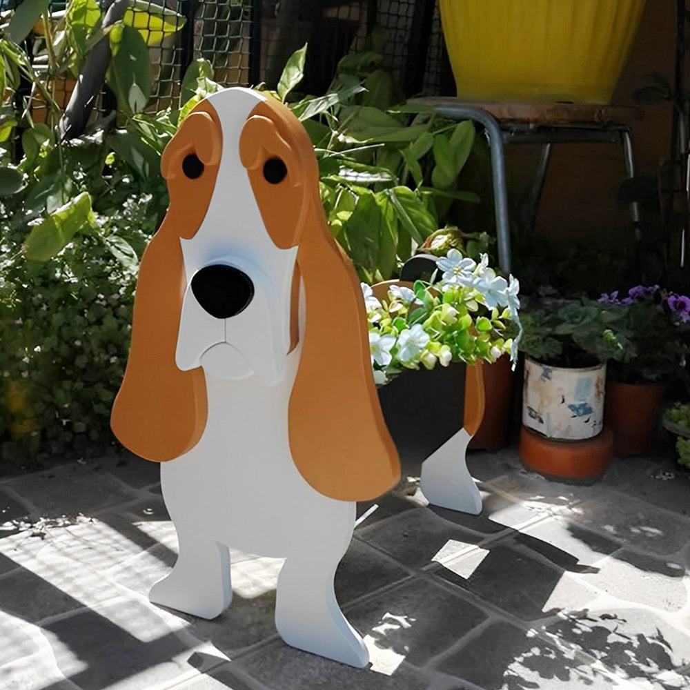 Basset Hound-shaped dog planter displayed on a patio with plants in the background
