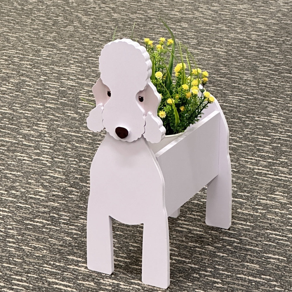 Bedlington Terrier dog planter with a flower arrangement on the carpet