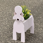 Bedlington Terrier dog planter with a flower arrangement on the carpet