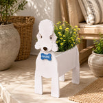Bedlington Terrier dog planter with a name tag and flowers on a patio
