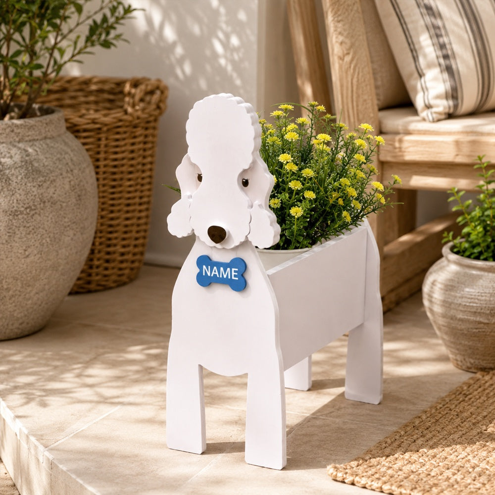 Bedlington Terrier dog planter with a name tag and flowers on a patio