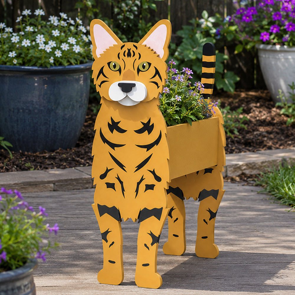Bengal cat planter filled with fresh flowers is placed in the garden
