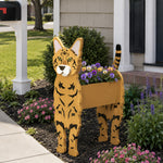 Bengal cat planter filled with fresh flowers is placed in the garden