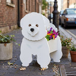 Bichon Friese dog planter filled with fresh flowers is placed in the garden