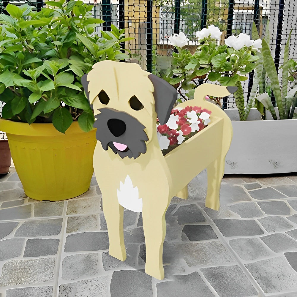 Border Terrier dog planter filled with fresh flowers is placed in the garden