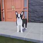 Boston Terrier dog planter filled with fresh flowers is placed in the garden