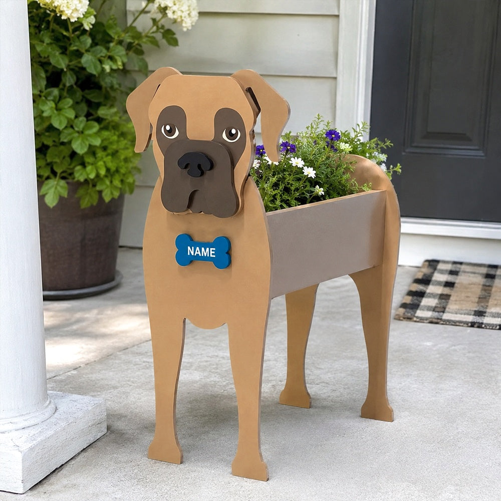 Boxer dog planter filled with fresh flowers is placed in the garden