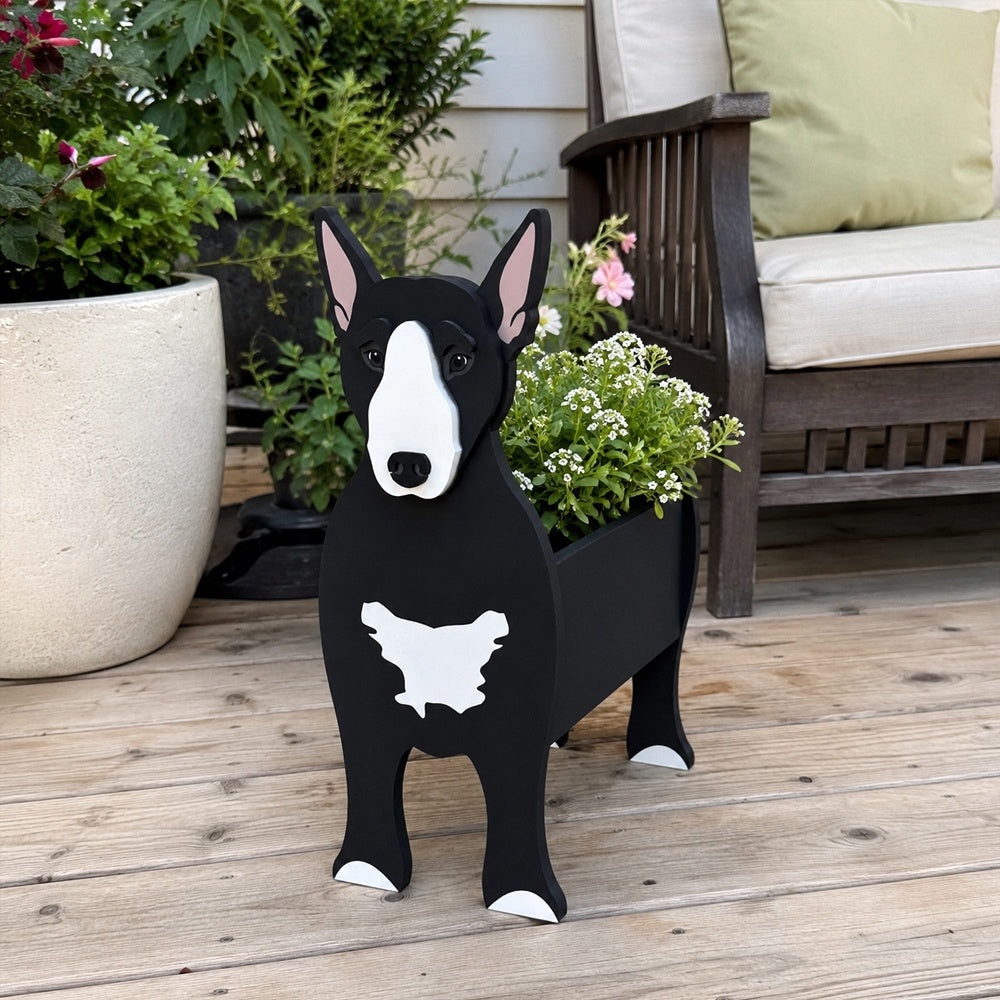 Bull Terrier dog planter filled with fresh flowers is placed in the garden