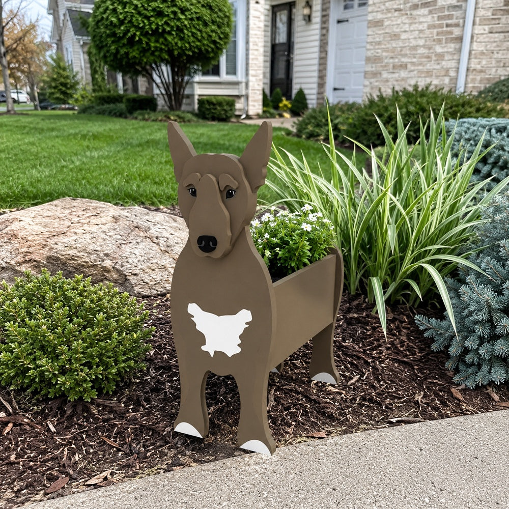 Bull Terrier dog planter filled with fresh flowers is placed in the garden