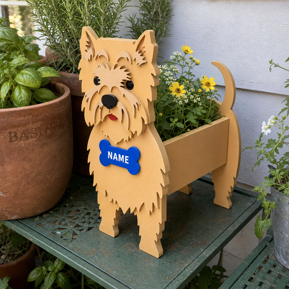 Cairn Terrier dog planter filled with fresh flowers is placed in the garden