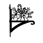 Candy cane and holly metal hanging basket bracket mounted on outdoor wall for plant decoration