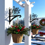 Candy cane and holly metal hanging basket bracket mounted on outdoor wall for plant decoration