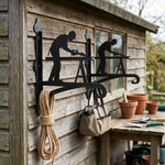 Carpenter woodworker metal hanging basket bracket mounted on outdoor wall for plant decoration