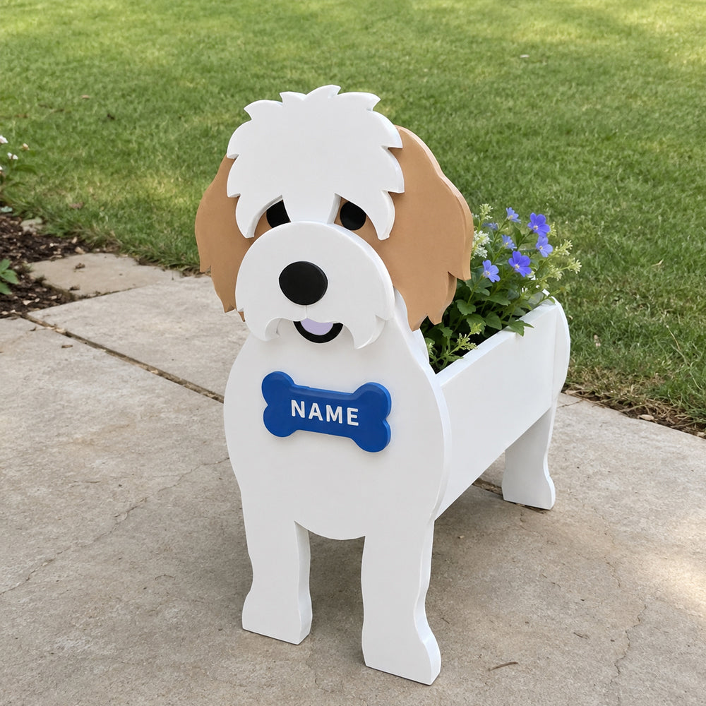 Cavachon dog planter filled with fresh flowers is placed in the garden