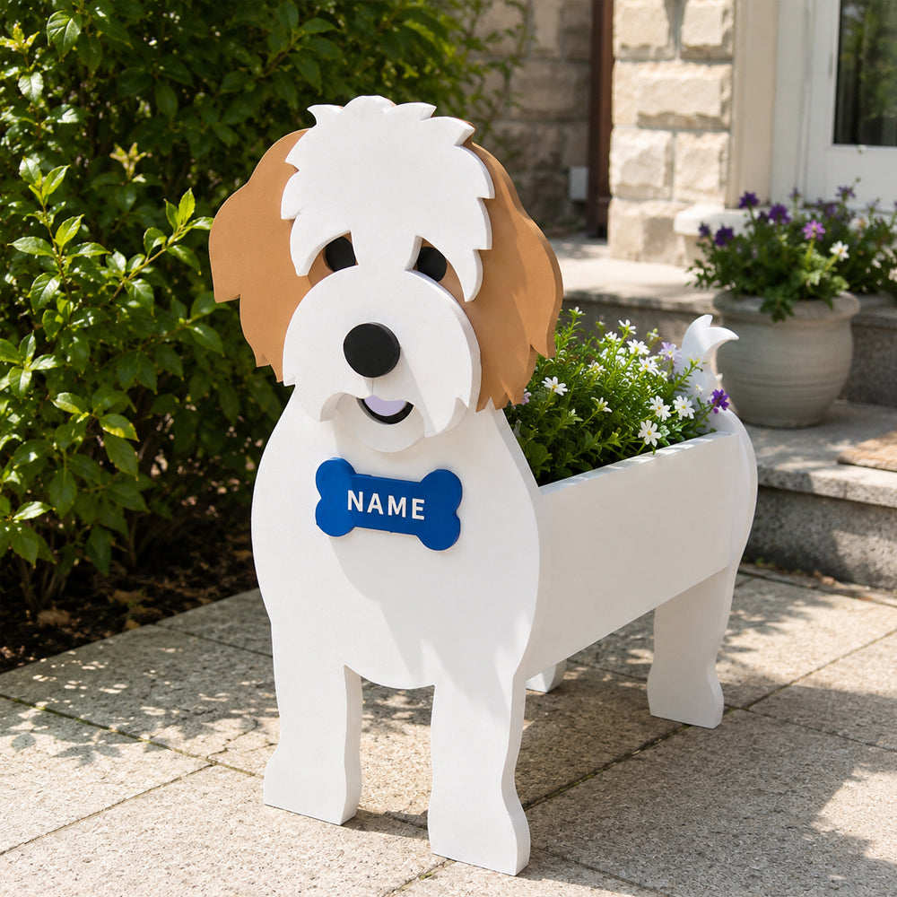 Cavachon dog planter filled with fresh flowers is placed in the garden