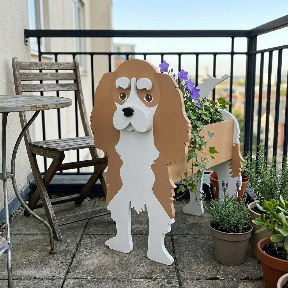Cavalier King Charles Spaniel dog planter filled with fresh flowers is placed in the garden.