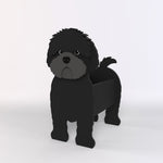 Adorable black cavapoo-shaped dog planter on a light gray background