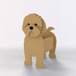 Adorable brown cavapoo-shaped dog planter on a light gray background