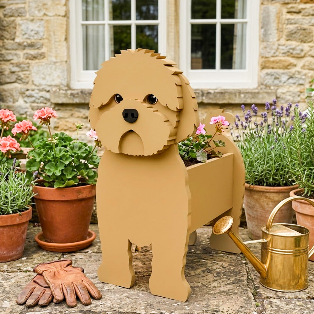 Brown cavapoo-shaped dog planter containing flowers, placed beneath a windowsill