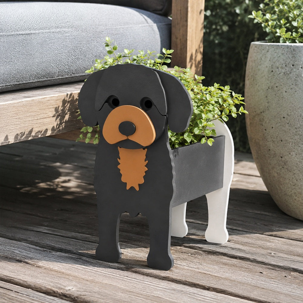 Cavoodle dog planter filled with fresh flowers is placed in the garden