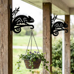 Chameleon lizard on vine metal hanging basket bracket mounted on outdoor wall for plant decoration