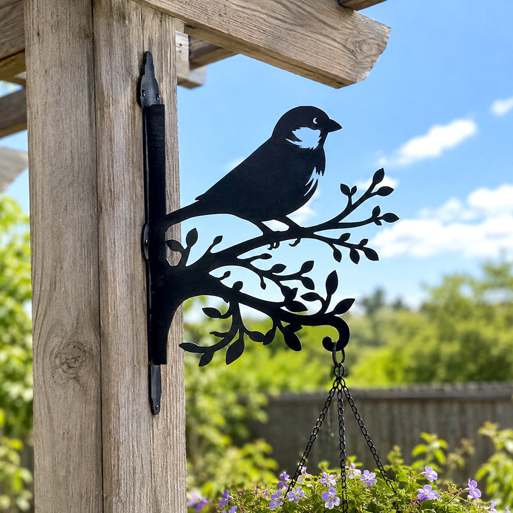 Chickadee bird on branch metal hanging basket bracket mounted on outdoor wall for plant decoration