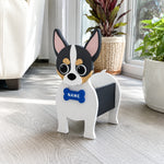 Chihuahua dog planter filled with fresh flowers is placed in the room