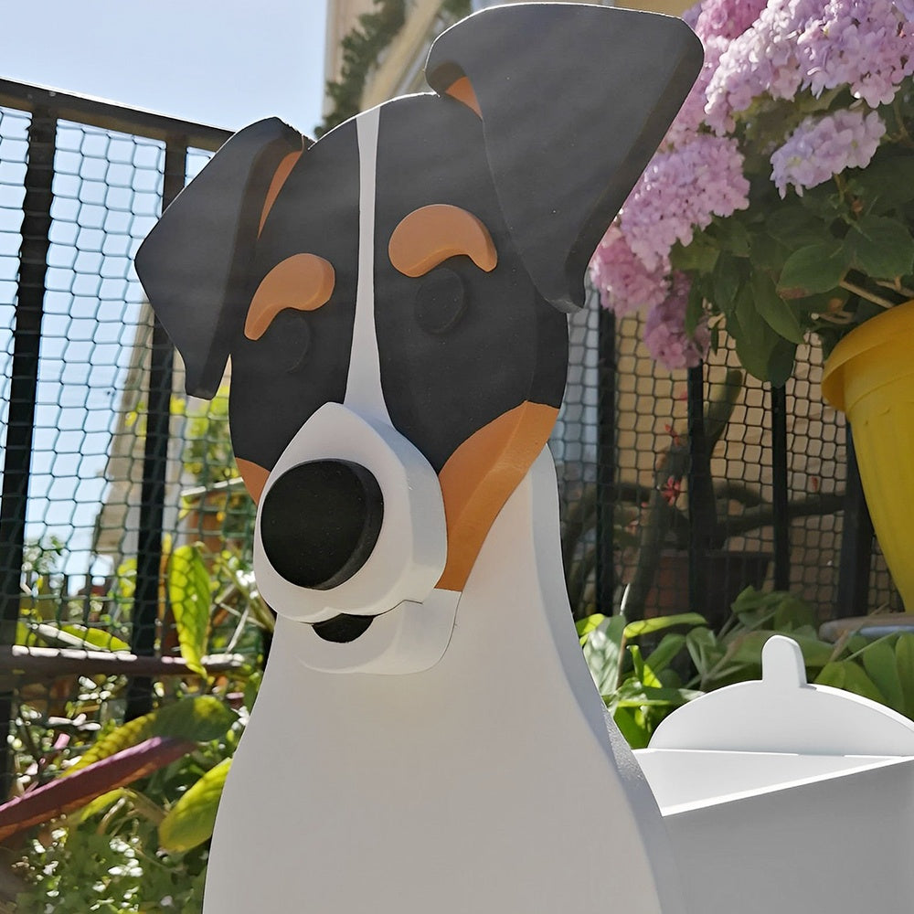 Chilean Fox Terrier dog planter filled with fresh flowers is placed in the garden