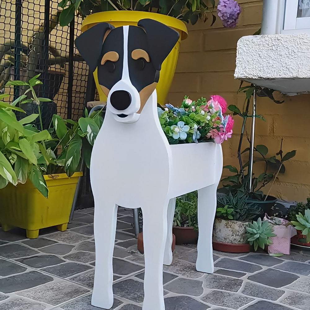 Chilean Fox Terrier dog planter filled with fresh flowers is placed in the garden