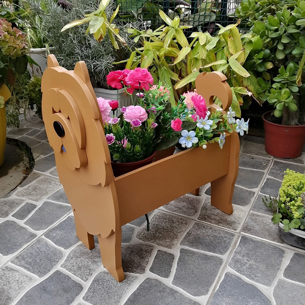 Chow Chow dog planter filled with fresh flowers is placed in the garden