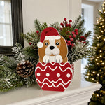 Christmas Beagle dog planter filled with fresh flowers is placed in the garden
