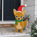 Christmas Chihuahua dog planter filled with fresh flowers is placed in the garden