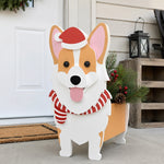 Christmas Corgi dog planter filled with fresh flowers is placed in the garden