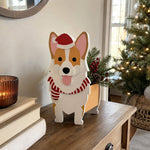 Christmas Corgi dog planter filled with fresh flowers is placed in the garden