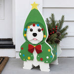 Christmas Doodle dog planter filled with fresh flowers is placed in the garden
