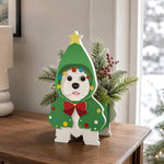 Christmas Doodle dog planter filled with fresh flowers is placed in the garden