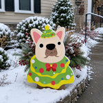Christmas French Bulldog planter filled with fresh flowers is placed in the garden