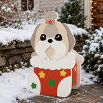 Christmas Lhasa Apso dog planter filled with fresh flowers is placed in the garden