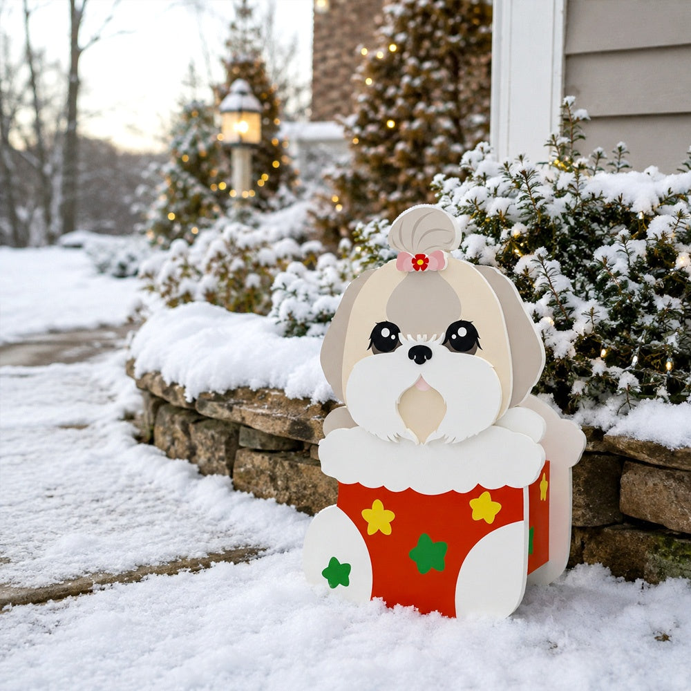 Christmas Lhasa Apso dog planter filled with fresh flowers is placed in the garden