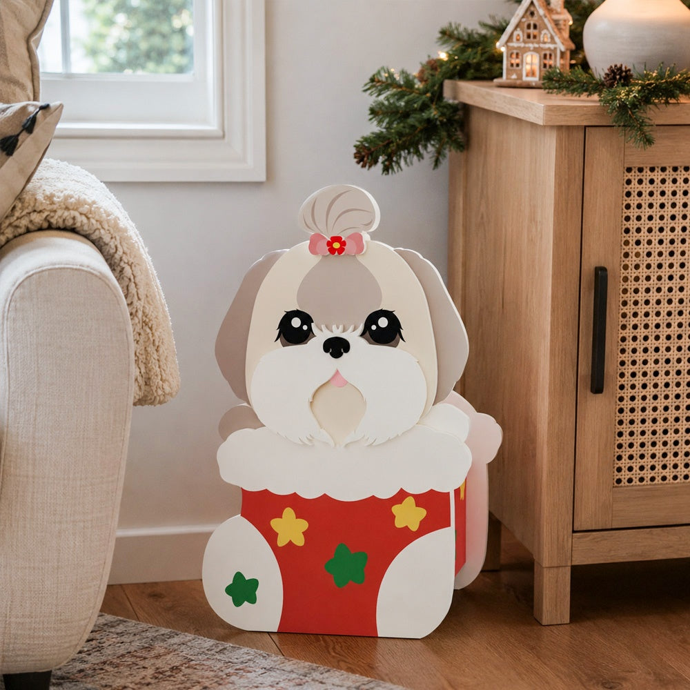 Christmas Lhasa Apso dog planter filled with fresh flowers is placed in the garden