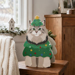 Christmas Maine Coon cat planter filled with fresh flowers is placed in the garden
